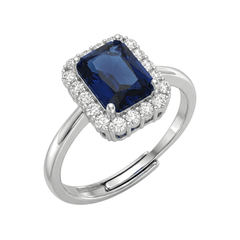 Ring mit rechteckigem blauen Stein und Zirkonen