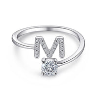 Ring Contrariè mit Anfangsbuchstaben und Lichtpunkt